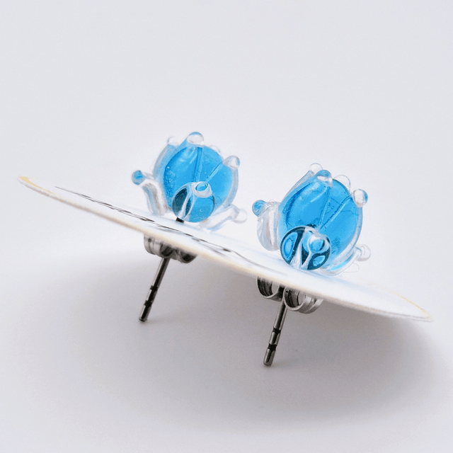 Puces d'oreilles - Clochettes bleues transparentes